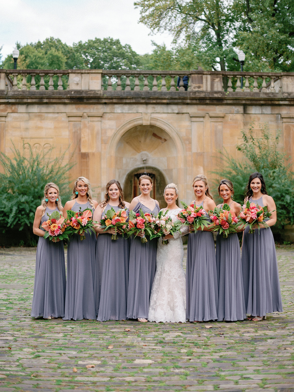 Bride and Bridesmaids holding bouquets by HeatherLily