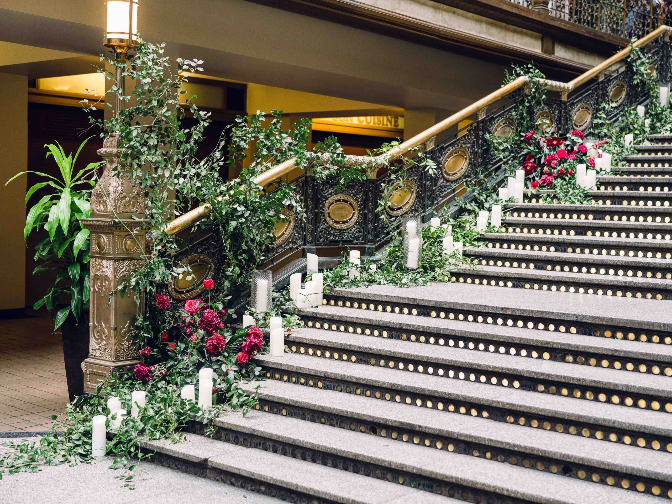 Main Staircase at Hyatt Cleveland with candle light and flowers for a winter wedding, flower by HeatherLily